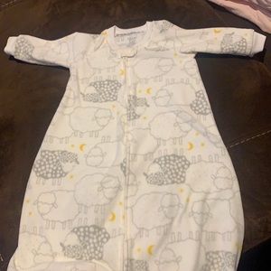 White and gray sheep sleep sack.